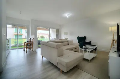 a living room with a couch and a table at IMMOGROOM - Terrace - Near shops - Parking - Wifi - AC livingroom in Cannes