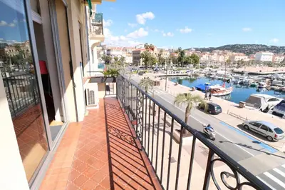 a balcony with a view of a marina at 1 bedroom with direct view to the Old Port 267 in Cannes