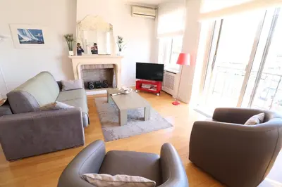 a living room with two couches and a fireplace at 1 bedroom with direct view to the Old Port 267 in Cannes