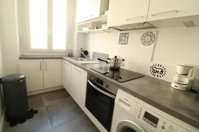 a kitchen with a sink and a stove top oven at 1 bedroom with direct view to the Old Port 267 in Cannes