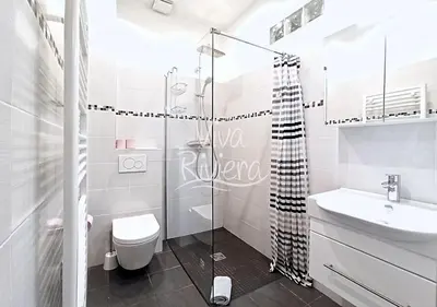 a bathroom with a shower and a toilet and a sink at Calm and Modern 1 Bedroom City Centre Cannes in Cannes