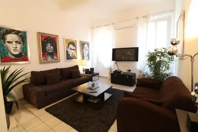 a living room with a couch and a tv at 1 Bedroom Joffre 2 mins from Palais des Festivals 263 in Cannes