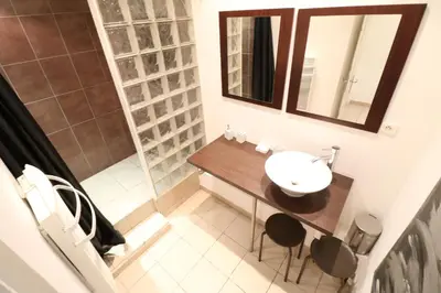a bathroom with a sink and a mirror at 1 Bedroom Joffre 2 mins from Palais des Festivals 263 in Cannes