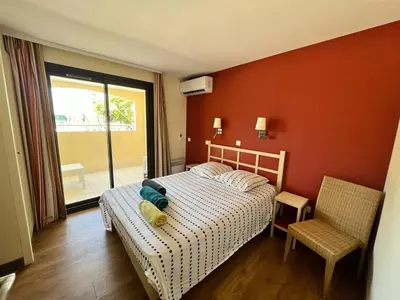 a bedroom with a bed and a window at Cannes Villa Francia in Cannes