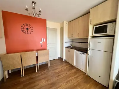 a kitchen with a table and chairs in a room at Cannes Villa Francia in Cannes