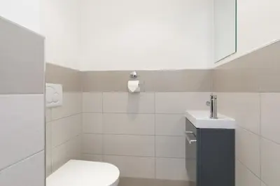 a bathroom with a toilet and a sink at Doris YourHostHelper in Cannes