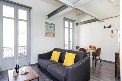 a living room with a couch and a table at Doris YourHostHelper in Cannes