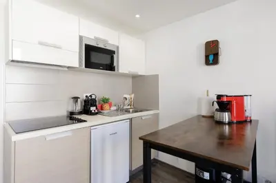a small kitchen with a sink and a counter at Doris YourHostHelper in Cannes