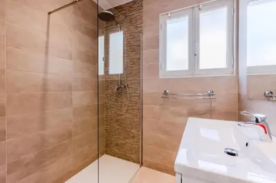 a bathroom with a shower and a sink at 2Br 3 min from the center & the Croisette in Cannes