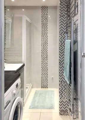 a bathroom with a washing machine and a shower at Appartement charmant à Cannes avec vue sur la mer, 33 m² in Cannes