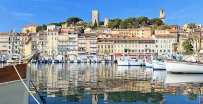 a group of boats docked in a harbor with buildings at C087-Comfortable apartment in the heart of Cannes in Cannes