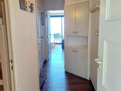 a kitchen with white cabinets and a hallway at Apartment Villa Francia-6 by Interhome in Cannes