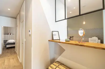 a room with a counter and a hallway with a bedroom at Luxurious flat in the heart of Cannes in Cannes