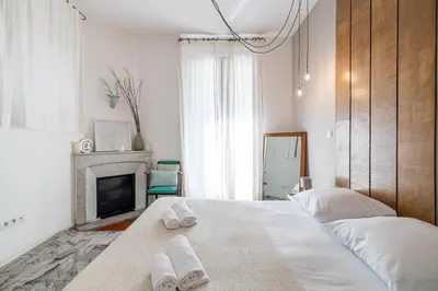 a bedroom with a large bed with towels on it at Luxurious flat in the heart of Cannes in Cannes