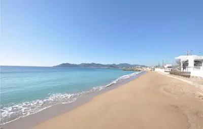 a view of a beach with the ocean at Amazing Apartment In Cannes With Wifi in Cannes