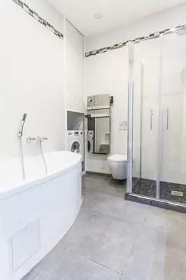 a white bathroom with a tub and a shower at CLOSE CROISETTE-MODERN-A/C-CONGRESS-BEACHES in Cannes