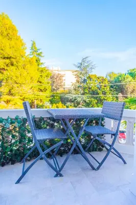 a table and two chairs sitting on a patio at CLOSE CROISETTE-MODERN-A/C-CONGRESS-BEACHES in Cannes