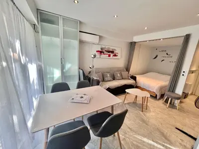 a room with a bed and a table and chairs at Jolies Lavandes, by Welcome to Cannes in Cannes