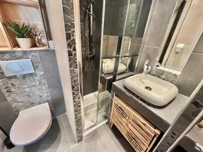 a bathroom with a sink and a toilet and a shower at Jolies Lavandes, by Welcome to Cannes in Cannes