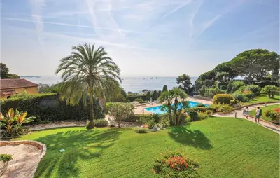 an aerial view of a garden with a swimming pool at 1 Bedroom Lovely Apartment In Cannes in Cannes