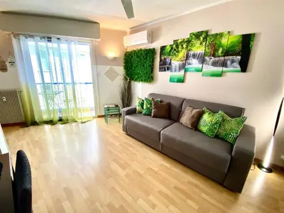 a living room with a couch in a room at Le Nouveau Port By SCLS Locations in Cannes