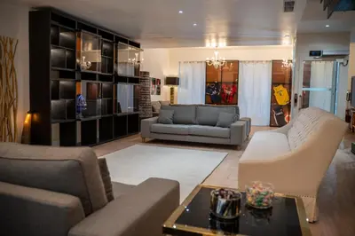 a living room with two couches and a table at Venue C - Luxurious & Spacious - Mansion - Elevator - Patio in Cannes
