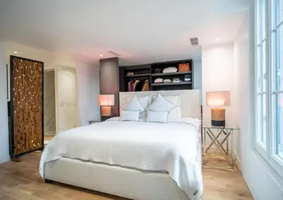 a bedroom with a white bed and a large window at Venue C - Luxurious & Spacious - Mansion - Elevator - Patio in Cannes