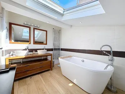a bathroom with a large white tub and two sinks at Rooftop terrasse 1 bedroom in rue d'Antibes, 5 min from the Croisette 214 in Cannes