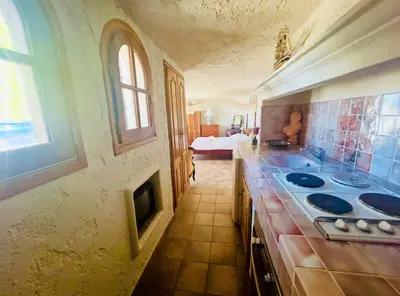 a kitchen with a sink and a room with a bed at Somptuous exotic villa in Cannes in Cannes