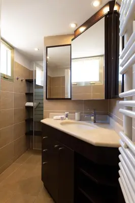 a bathroom with a sink and a mirror at Rooftop View - 2 BdR 2 BthR 1 toil - Clim Terrace Elevator small Parking in Cannes