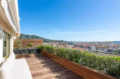a balcony with a view of a city at Rooftop View - 2 BdR 2 BthR 1 toil - Clim Terrace Elevator small Parking in Cannes