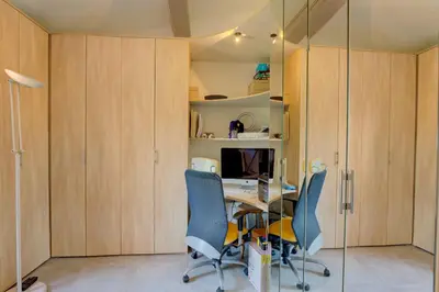 an office with a desk and blue chairs at MAGNIFIQUE VILLA 8 PERSONNES in Vallauris