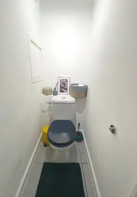 a room with a television and two poles in a room at à 10 min de la Croisette - pieds dans la mer in Cannes