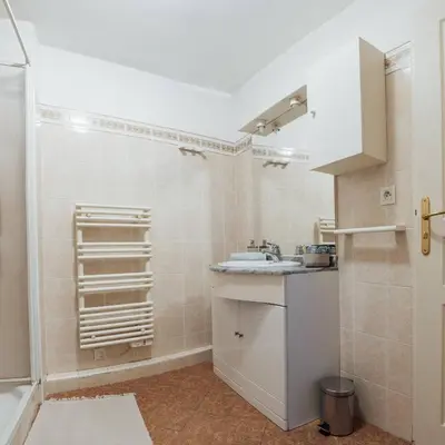 a bathroom with a sink and a shower at la petit maisonette de manu in Cannes