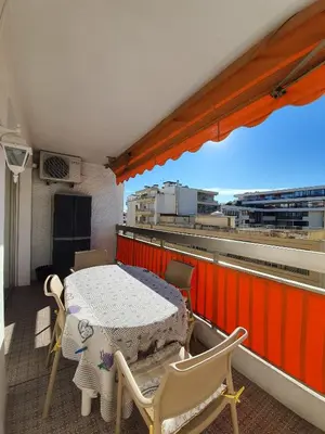 a balcony with a table and chairs on a roof at Kent studio by Welcome to Cannes in Cannes