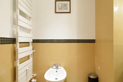 a bathroom with a toilet and a sink at On la Croisette XXL 1 bedroom with amazing sea view in Cannes