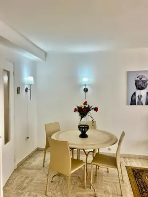 a dining room with a table and chairs at LUXURY APARTMENT between ANTIBS and CROISETTE in Cannes