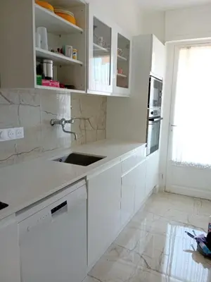 a white kitchen with white cabinets and a sink at LUXURY APARTMENT between ANTIBS and CROISETTE in Cannes