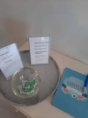 a table with a glass bowl and cards on it at Cannes beach and Festival Palais in Cannes