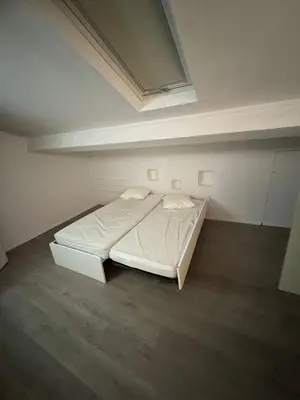 a bedroom with a white bed in a room at Serbes Top Floor in Cannes