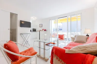 a living room with two chairs and a table at Luxurious 2-room Apartment in Palm Beach in Cannes