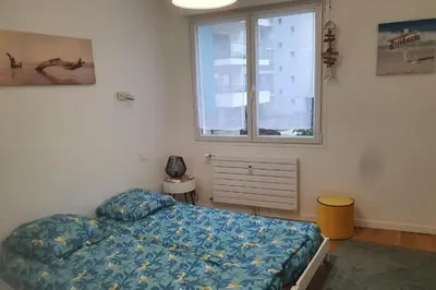 a bedroom with a bed and a window at Bel Apt Near Croisette Beach Cannes in Cannes