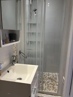 a bathroom with a shower and a sink at STUDETTE Beausejour in Cannes