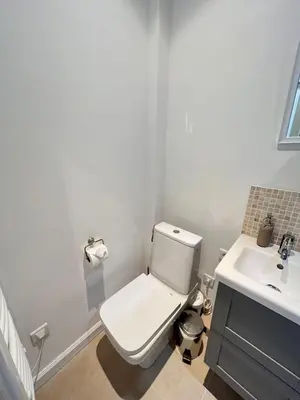 a bathroom with a white toilet and a sink at Nice 2 bedrooms Meynadier at 2 min BeachPalais in Cannes