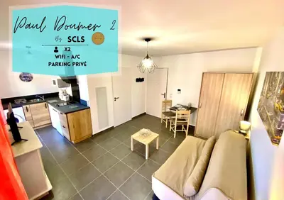 a living room with a couch and a table at Paul Doumer #2 By SCLS Locations in Le Cannet