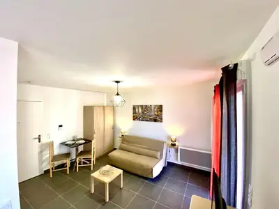 a living room with a couch and a table at Paul Doumer #2 By SCLS Locations in Le Cannet