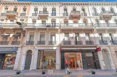a large white building with balconies on a street at Arundel Croisette 100m Beach, Palais Free Parking AC Fibre in Cannes