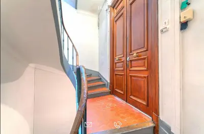 a staircase leading up to a wooden door at Arundel Croisette 100m Beach, Palais Free Parking AC Fibre in Cannes