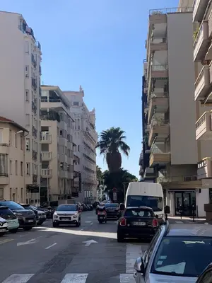 a busy city street filled with cars and buildings at Les jardins de la Croisette 6, by Welcome to Cannes in Cannes