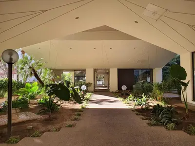 a large white building with a large roof at Les jardins de la Croisette 6, by Welcome to Cannes in Cannes